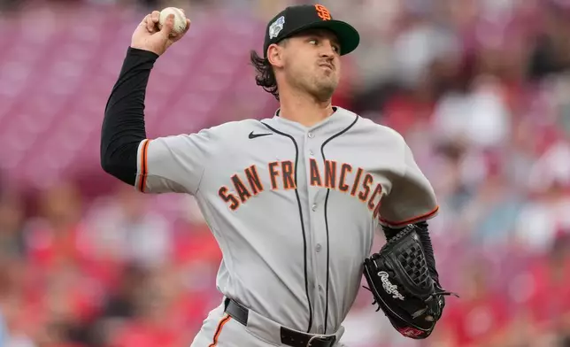 San Francisco Giants pitcher Tyler Mahle throws during the first inning of a baseball game against the Cincinnati Reds in Cincinnati, Wednesday, April 15, 2026. (AP Photo/Carolyn Kaster)