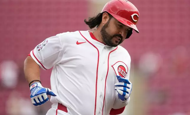 Cincinnati Reds' Eugenio Suárez rounds the bases after hitting a solo home run during the first inning of a baseball game against the San Francisco Giants in Cincinnati, Wednesday, April 15, 2026. (AP Photo/Carolyn Kaster)