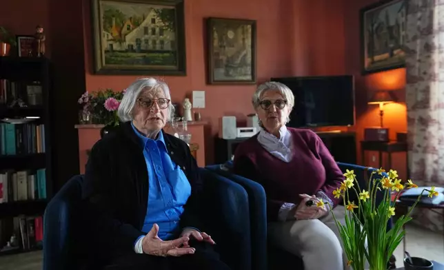 Brigitte Beernaert, left, and Jo Verplaetsen speak during an interview in a house inside the Beguinage Ten Wijngaerde in Bruges, Belgium, Wednesday, April 15, 2026. (AP Photo/Virginia Mayo)