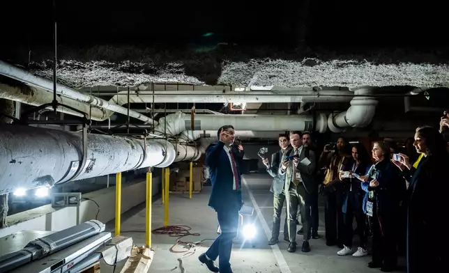 Matt Floca, the John F. Kennedy Center for the Performing Arts' new executive director and chief operating officer, shows damage in the parking garage during a media tour, Wednesday, April 22, 2026, in Washington. (AP Photo/Julia Demaree Nikhinson)