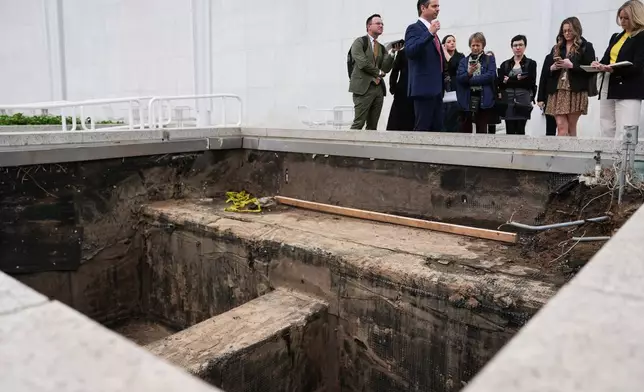 Matt Floca, the John F. Kennedy Center for the Performing Arts' new executive director and chief operating officer, shows an expansion joint during a media tour intended to show building damage, Wednesday, April 22, 2026, in Washington. (AP Photo/Julia Demaree Nikhinson)