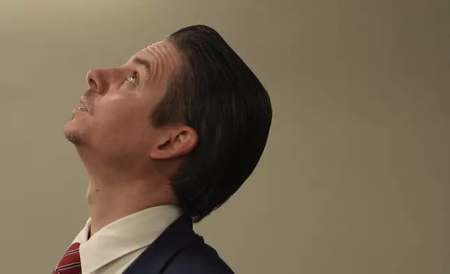 Matt Floca, the John F. Kennedy Center for the Performing Arts' new executive director and chief operating officer, looks up at structural damage in the loading dock area during a media tour, Wednesday, April 22, 2026, in Washington. (AP Photo/Julia Demaree Nikhinson)