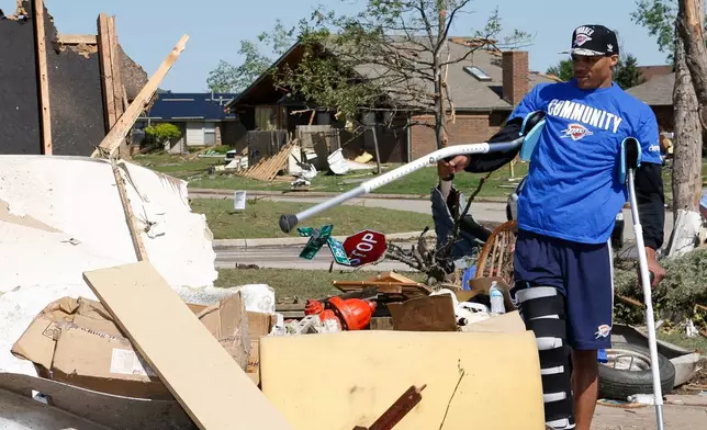 FILE - Oklahoma City Thunder guard Russell Westbrook tours the tornado damage in Moore, Okla., Wednesday, May 22, 2013. A huge tornado roared through the Oklahoma City suburb on Monday, flattening everything in its path. (AP Photo/Alonzo Adams, File)