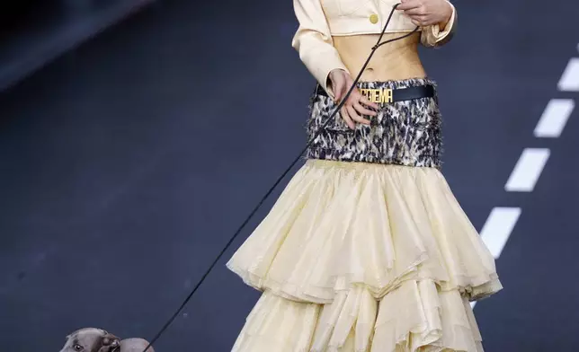 FILE - A model wears a creation by Maggie Ma during China Fashion Week (Spring) 2026 in Beijing, China, March 25, 2026. (AP Photo/Vincent Thian, File)