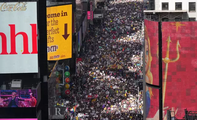 FILE - People attend a "No Kings" protest March 28, 2026, in New York. (AP Photo/Adam Gray, File)