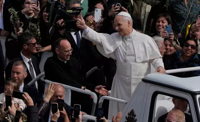 FILE - Pope Leo XIV leaves after presiding over Mass in St. Peter's Square at the Vatican on the Catholic feast of Palm Sunday, commemorating Jesus' arrival in Jerusalem, March 29, 2026.(AP Photo/Alessandra Tarantino, File)