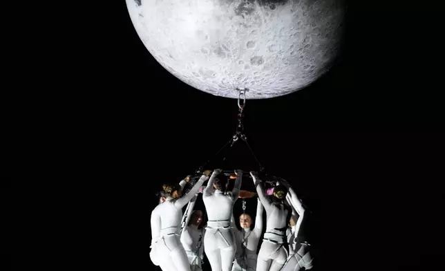 FILE - Members of Zenit Aerial Ballet perform during the International Fine Arts Festival in Bogota, Colombia, March 28, 2026. (AP Photo/Fernando Vergara, File)