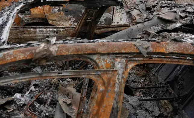 FILE - A view of the damages at Hypercar, an auto service center, which, according to the company's officials, were caused by strikes on March 1, in Tehran, Iran, March 28, 2026. (AP Photo/Vahid Salemi, File)