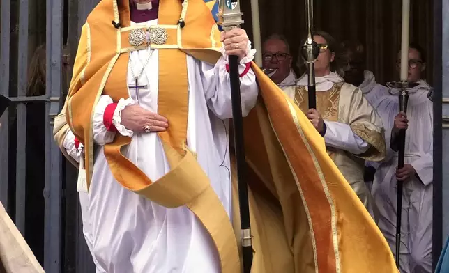 FILE - Sarah Mullally leaves the Cathedral after the Enthronement Ceremony installing her as archbishop of Canterbury in Canterbury, England, March 25, 2026, the first woman ever to lead the Church of England. (AP Photo/Alastair Grant, File)