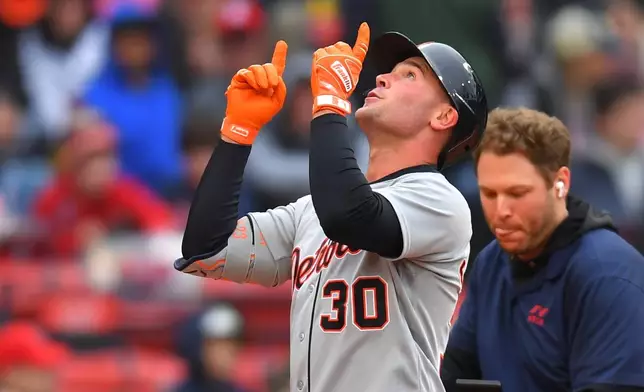 Detroit Tigers' Kerry Carpenter (30) celebrates after his home run as he arrives at home plate in the fourth inning of a baseball game against the Boston Red Sox, Saturday, April 18, 2026, in Boston. (AP Photo/Steven Senne)