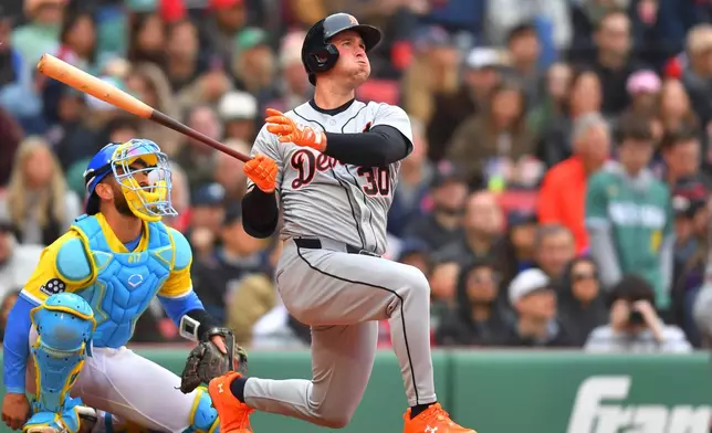 Detroit Tigers' Kerry Carpenter (30) watches his home run in front of Boston Red Sox catcher Connor Wong, left, in the fourth inning of a baseball game, Saturday, April 18, 2026, in Boston. (AP Photo/Steven Senne)