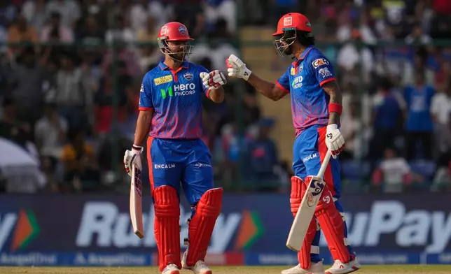 Delhi Capitals' KL Rahul, right, celebrates after hits a six with batting partner Nitish Rana during the Indian Premier League cricket match between Delhi Capitals and Punjab Kings in New Delhi, India, Saturday, April 25, 2026. (AP Photo/Manish Swarup)