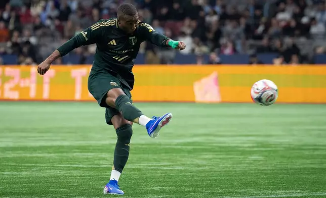 Portland Timbers' Juan Mosquera scores against the Vancouver Whitecaps during the first half of an MLS soccer match in Vancouver, British Columbia, on Saturday, April 4, 2026. (Ethan Cairns/The Canadian Press via AP)