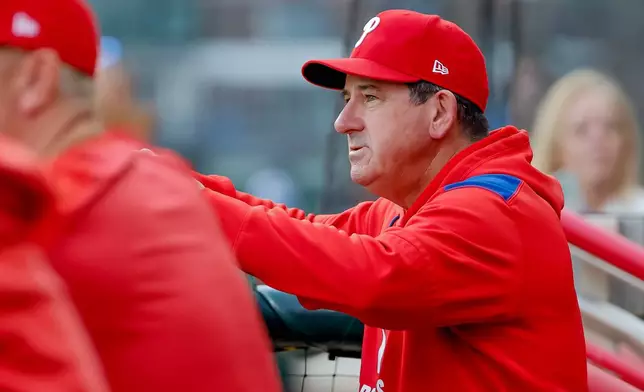 Philadelphia Phillies manager Rob Thomson in the dugout before playing the Atlanta Braves in a baseball game, Friday, April 24, 2026, in Atlanta. (AP Photo/Erik S. Lesser)