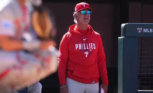 FILE - Philadelphia Phillies bench coach Don Mattingly (8) watches from the dugout steps during the sixth inning of a baseball game against the Colorado Rockies, April 5, 2026, in Denver. (AP Photo/David Zalubowski, File)