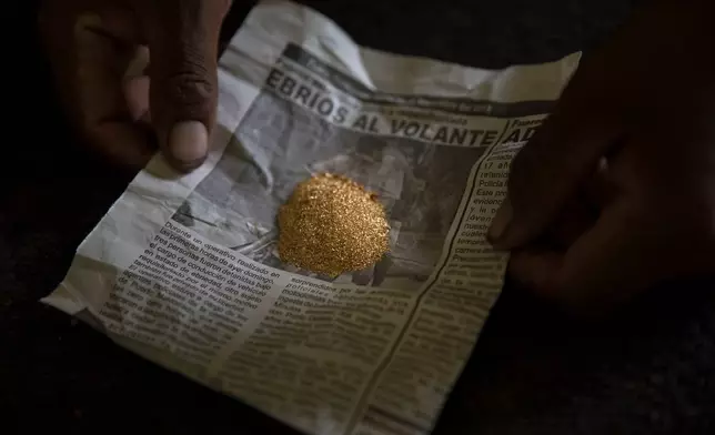 FILE - Gold collected after a day of work is ready to be weighed at a mining camp in Madre de Dios, Peru, April 5, 2019. (AP Photo/Rodrigo Abd, File)