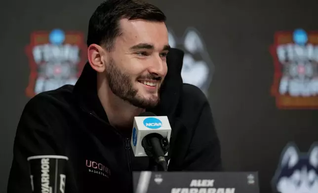 UConn forward Alex Karaban speaks during a news conference ahead of a national championship NCAA college basketball tournament game against Michigan at the Final Four, Sunday, April 5, 2026, in Indianapolis. (AP Photo/Jeff Roberson)