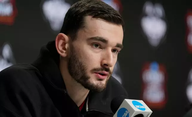 UConn forward Alex Karaban speaks during a news conference ahead of a national championship NCAA college basketball tournament game against Michigan at the Final Four, Sunday, April 5, 2026, in Indianapolis. (AP Photo/Jeff Roberson)