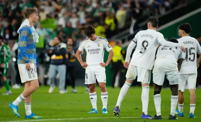 Real Madrid players stand dejected after a La Liga soccer match between Real Betis and Real Madrid in Seville, Spain, Friday, April 24, 2026. (AP Photo/Jose Breton)