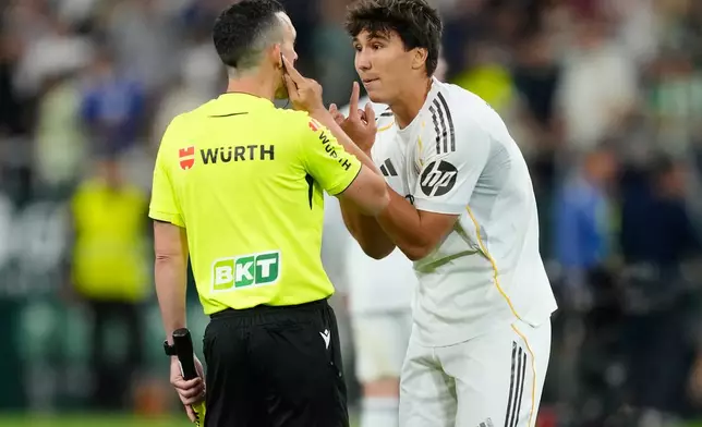 Real Madrid's Gonzalo Garcia argues with a referee after a La Liga soccer match between Real Betis and Real Madrid in Seville, Spain, Friday, April 24, 2026. (AP Photo/Jose Breton)
