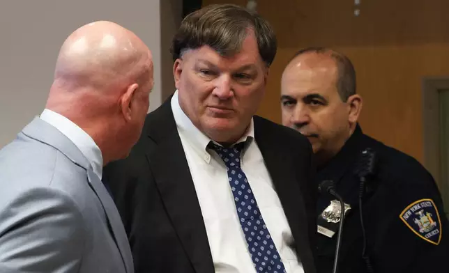 Rex A. Heuermann, center, pleads guilty to murdering seven women and admitted he killed an eighth in a string of long-unsolved crimes known as the Gilgo Beach killings, at a court hearing in Suffolk County Court in Riverhead, N.Y., Wednesday, April 8, 2026. (James Carbone/Newsday via AP, Pool)