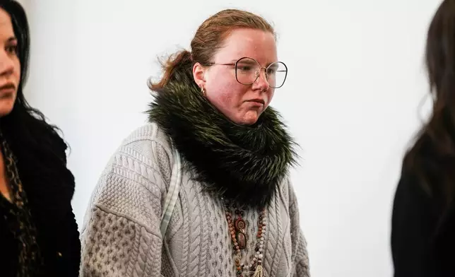 Victoria Heuermann walks to the courtroom as Rex Heuermann, accused in Long Island's infamous Gilgo Beach serial killings, is expected to plead guilty, Wednesday, April 8, 2026, at Suffolk County Court in Riverhead, N.Y. (AP Photo/Eduardo Munoz Alvarez)