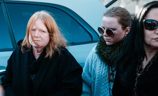 Asa Ellerup, wife, left and her daughter Victoria Heuermann arrive outside court as Rex Heuermann, accused in Long Island’s infamous Gilgo Beach serial killings, is expected to plead guilty, Wednesday, April 8, 2026, at Suffolk County Court in Riverhead, N.Y. (AP Photo/Eduardo Munoz Alvarez)