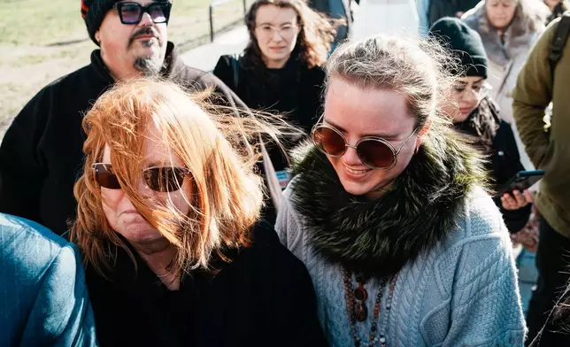 Asa Ellerup, left and her daughter Victoria Heuermann arrive outside court as Rex Heuermann, accused in Long Island’s infamous Gilgo Beach serial killings, is expected to plead guilty, Wednesday, April 8, 2026, at Suffolk County Court in Riverhead, N.Y. (AP Photo/Eduardo Munoz Alvarez)