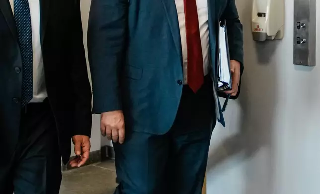 Suffolk County District Attorney Raymond A. Tierney walks to the courtroom as Rex Heuermann, accused in Long Island's infamous Gilgo Beach serial killings, is expected to plead guilty, Wednesday, April 8, 2026, at Suffolk County Court in Riverhead, N.Y. (AP Photo/Eduardo Munoz Alvarez)