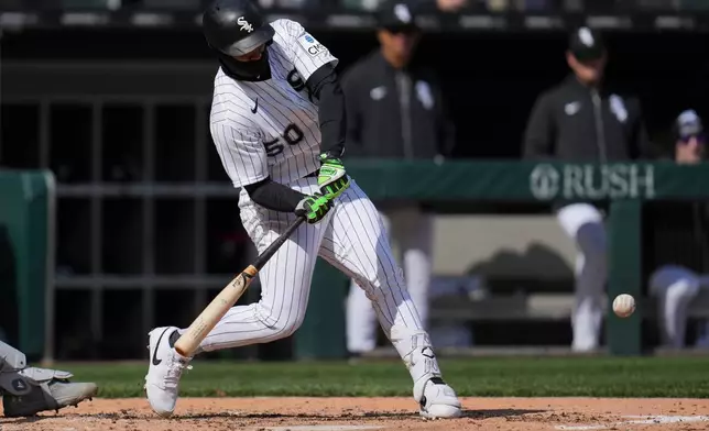 Chicago White Sox's Lenyn Sosa hits an RBI single during the third inning of a baseball game against the Baltimore Orioles, Tuesday, April 7, 2026, in Chicago. (AP Photo/Erin Hooley)