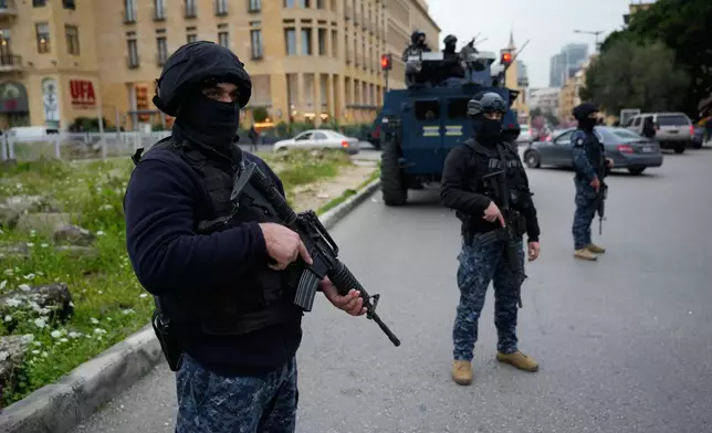 Special forces police officers deployed amid tensions between people displaced by Israeli strikes and local residents in Beirut neighborhoods, Lebanon, Wednesday, April 1, 2026. (AP Photo/Hussein Malla)
