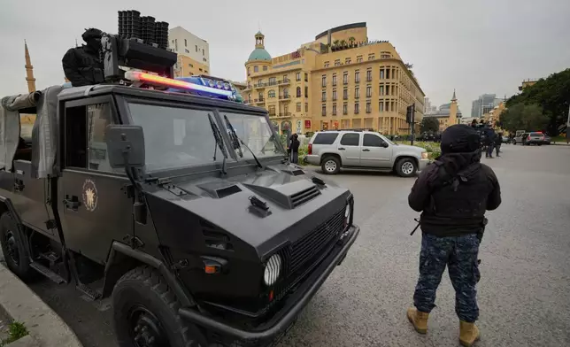 Special forces police officers deployed amid tensions between people displaced by Israeli strikes and local residents in Beirut neighborhoods, Lebanon, Wednesday, April 1, 2026. (AP Photo/Hussein Malla)