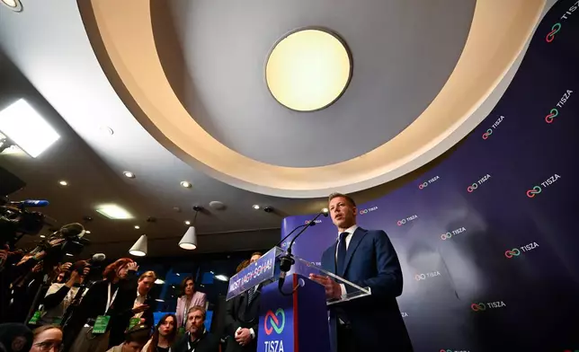 Peter Magyar, leader of the opposition Tisza party, speaks to the media after polls closed, during the Hungarian parliamentary election in Budapest, Hungary, Sunday, April 12, 2026. (AP Photo/Denes Erdos)
