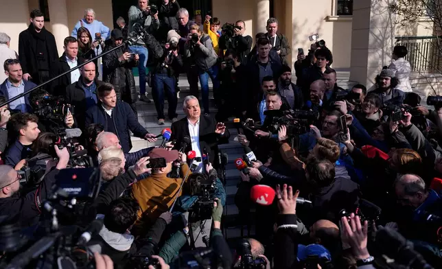 Hungary's Prime Minister Viktor Orban addresses the media outside a polling station after voting in Budapest, Hungary, Sunday, April 12, 2026. (AP Photo/Petr David Josek)