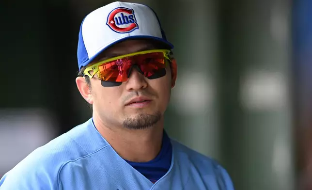 Chicago Cubs' Seiya Suzuki looks on from the dugout before a baseball game against the Pittsburgh Pirates in Chicago, Friday, April 10, 2026. (AP Photo/Paul Beaty)