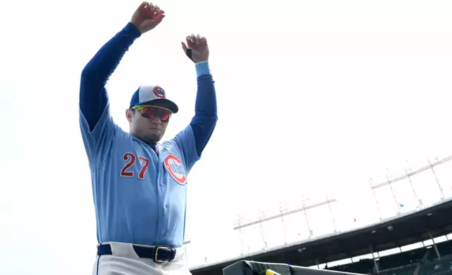 Chicago Cubs' Seiya Suzuki walks to the dugout before a baseball game against the Pittsburgh Pirates in Chicago, Friday, April 10, 2026. (AP Photo/Paul Beaty)