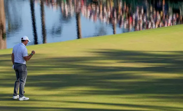 Rory McIlroy, of Northern Ireland, celebrates after a putt on the 16th hole during the second round of the Masters golf tournament at the Augusta National Golf Club, Friday, April 10, 2026, in Augusta, Ga. (AP Photo/Ashley Landis)