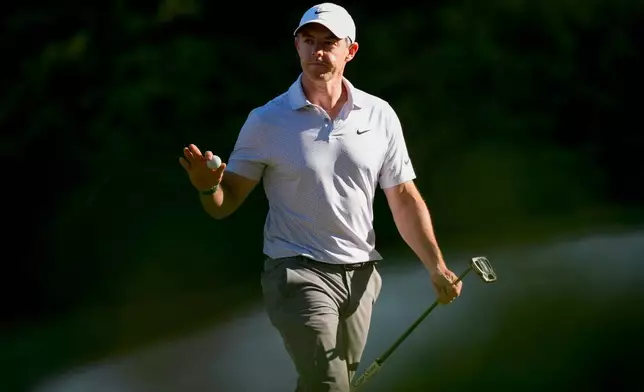 Rory McIlroy, of Northern Ireland, waves after his putt on the 13th hole during the second round of the Masters golf tournament at the Augusta National Golf Club, Friday, April 10, 2026, in Augusta, Ga. (AP Photo/Matt Slocum)