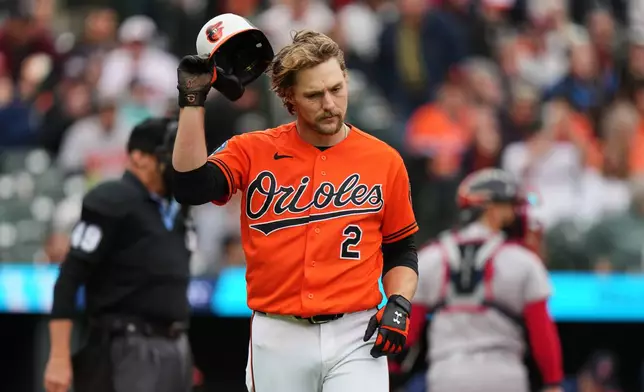 Baltimore Orioles' Gunnar Henderson (2) throws his helmet to the ground after striking out during the third inning of a baseball game against the Boston Red Sox, Saturday, April 25, 2026, in Baltimore. (AP Photo/Stephanie Scarbrough)