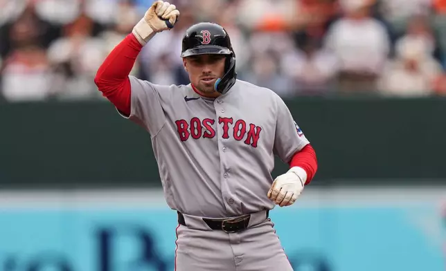 Boston Red Sox' Caleb Durbin celebrates after hitting an RBI double during the second inning of a baseball game against the Baltimore Orioles, Saturday, April 25, 2026, in Baltimore. (AP Photo/Stephanie Scarbrough)