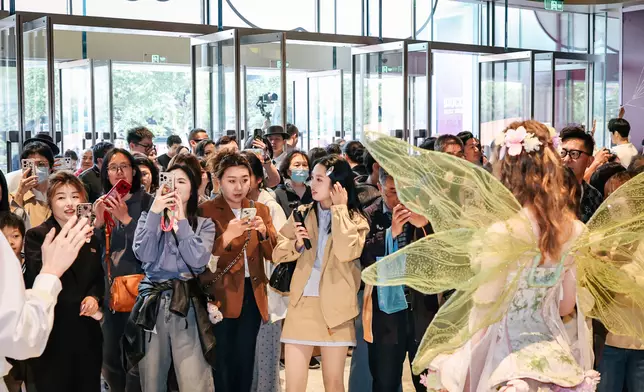 Waves of shoppers fill the Westlake 66 on its opening day