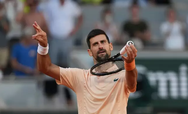 Novak Djokovic of Serbia celebrates after winning against Valentin Royer of France during their second round men's singles tennis match at the French Open tennis tournament in Paris, Wednesday, May 27, 2026. (AP Photo/Thibault Camus)