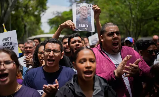 University student protest for justice for Carmen Navas the day after her death in Caracas, Venezuela, Monday, May 18, 2026, a week after the government confirmed that her missing son Victor Hugo Quero had died in custody following his arrest about a year earlier. (AP Photo/Ariana Cubillos)