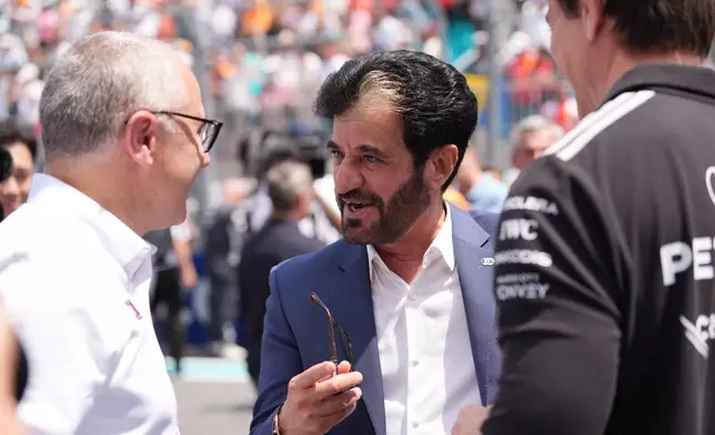 FIA president Mohammed Ben Sulayem greets people before a sprint auto race at the Miami Formula One Grand Prix, Saturday, May 2, 2026, in Miami Gardens, Fla. (AP Photo/Rebecca Blackwell)