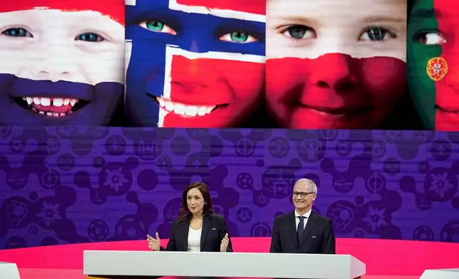FILE - UEFA's chief of women's football, Nadine Kessler and UEFA deputy general secretary Giorgio Marchetti host the UEFA Euro 2025 European women's soccer championship final draw at the Swiss Tech Convention Centre in Lausanne, Switzerland, Monday, Dec. 16, 2024. (AP Photo/Laurent Cipriani, File)