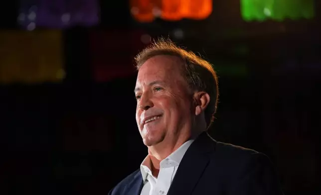 Texas Attorney General Ken Paxton, a Republican candidate for the U.S. Senate, smiles at a campaign event in McKinney, Texas, Tuesday, May 19, 2026. (AP Photo/LM Otero)