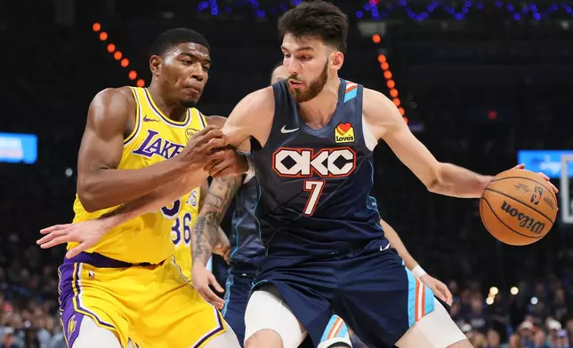 Oklahoma City Thunder center Chet Holmgren (7) works to the basket against Los Angeles Lakers forward Rui Hachimura (28) in the second half of Game 2 in a second-round NBA basketball playoffs series Thursday, May 7, 2026, in Oklahoma City. (AP Photo/Nate Billings)