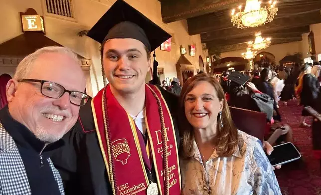 Associated Press sports writer Howard Fendrich, left, his son Stefano Fendrich and wife Rosanna Maietta pose for a selfie, May 15, 2025, in Los Angeles. (AP Photo/Howard Fendrich)