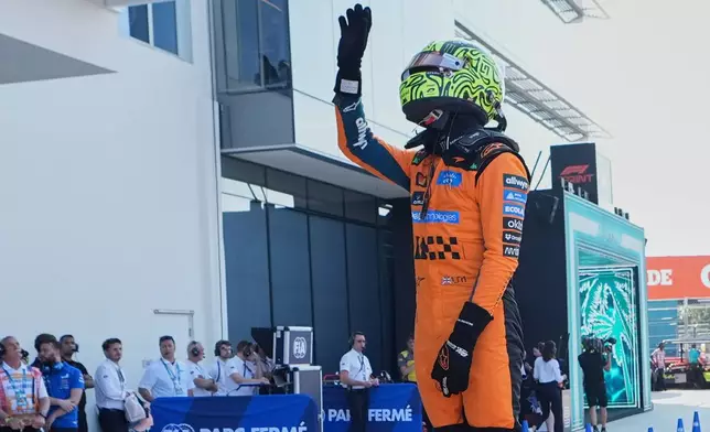 McLaren driver Lando Norris of Britain celebrates his pole position after qualifying session for the sprint race ahead of the Miami Formula One Grand Prix, Friday, May 1, 2026, in Miami Gardens, Fla. (AP Photo/Lynne Sladky)