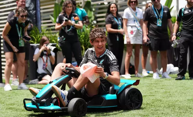 Mercedes driver Andrea Kimi Antonelli of Italy drives a miniature vehicle during an event with the Miami Dolphins ahead of the Formula One Miami Grand Prix auto race, Thursday, April 30, 2026, in Miami Gardens, Fla. (AP Photo/Rebecca Blackwell)